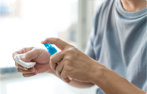stock-photo-asia-man-is-spraying-alcohol-on-medical-cotton-swab-for-cleaning-and-disinfection-in-first-aid-1924760711 1
